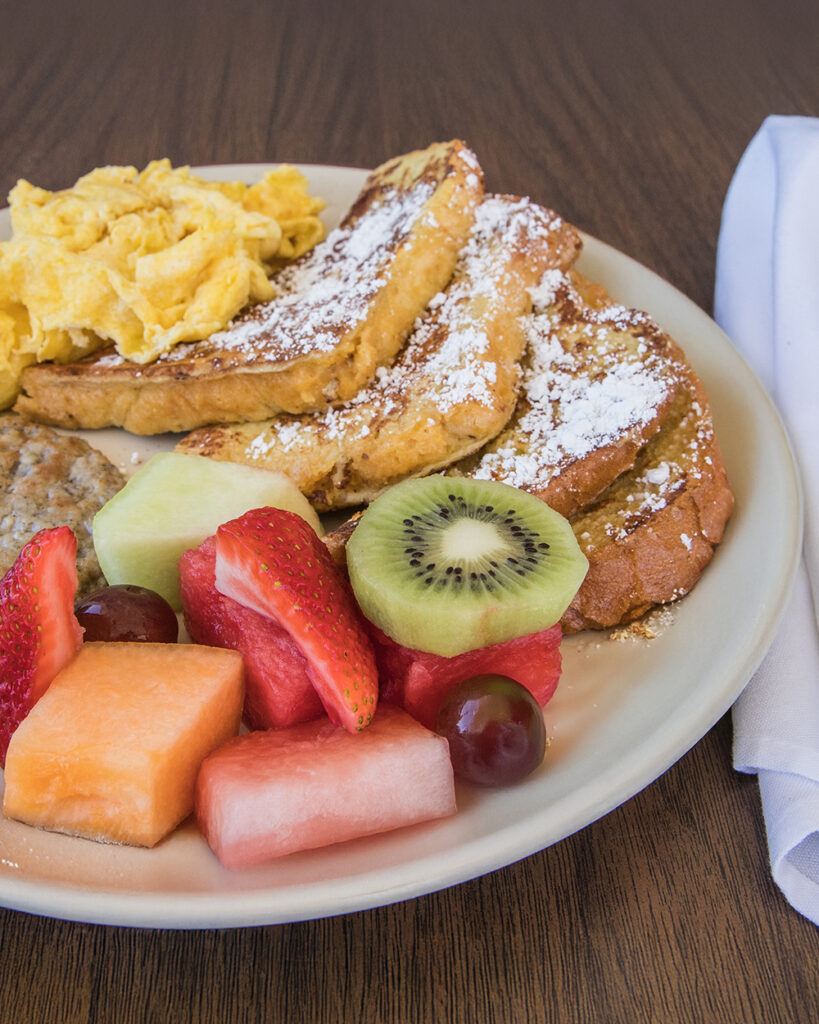 brown food on brown table with fresh fruit to add contrast and interest in food photography by Nancy Ingersoll in southern california restaurant